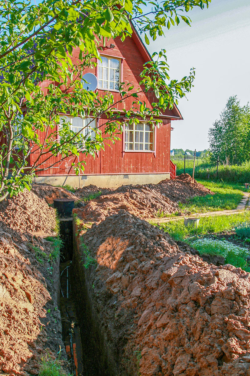 Excavating a drainage ditch on a Vermont House
